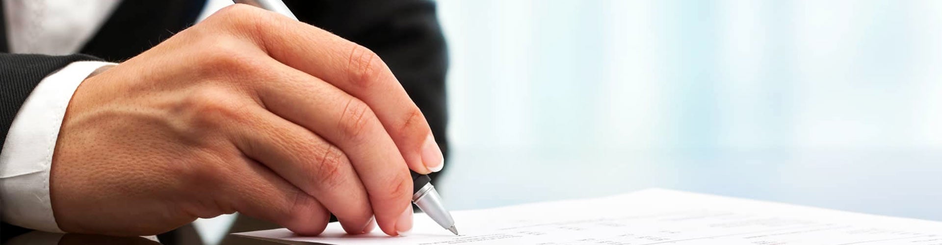 Man signing a contract Lynch Mukwonago in Mukwonago WI